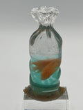 Bag of goldfish created with epoxy/height is 6 1/4 inches width is 3 inches /weight is 11.5 ounces /item 321