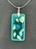 Pendant / 2 inch /teal glitter/seashell iridescent pearl center /item 2

measures 2” by 1”
