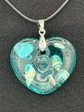 Pendant / 1.5 inch /teal glitter/seashell iridescent pearl center/item 1