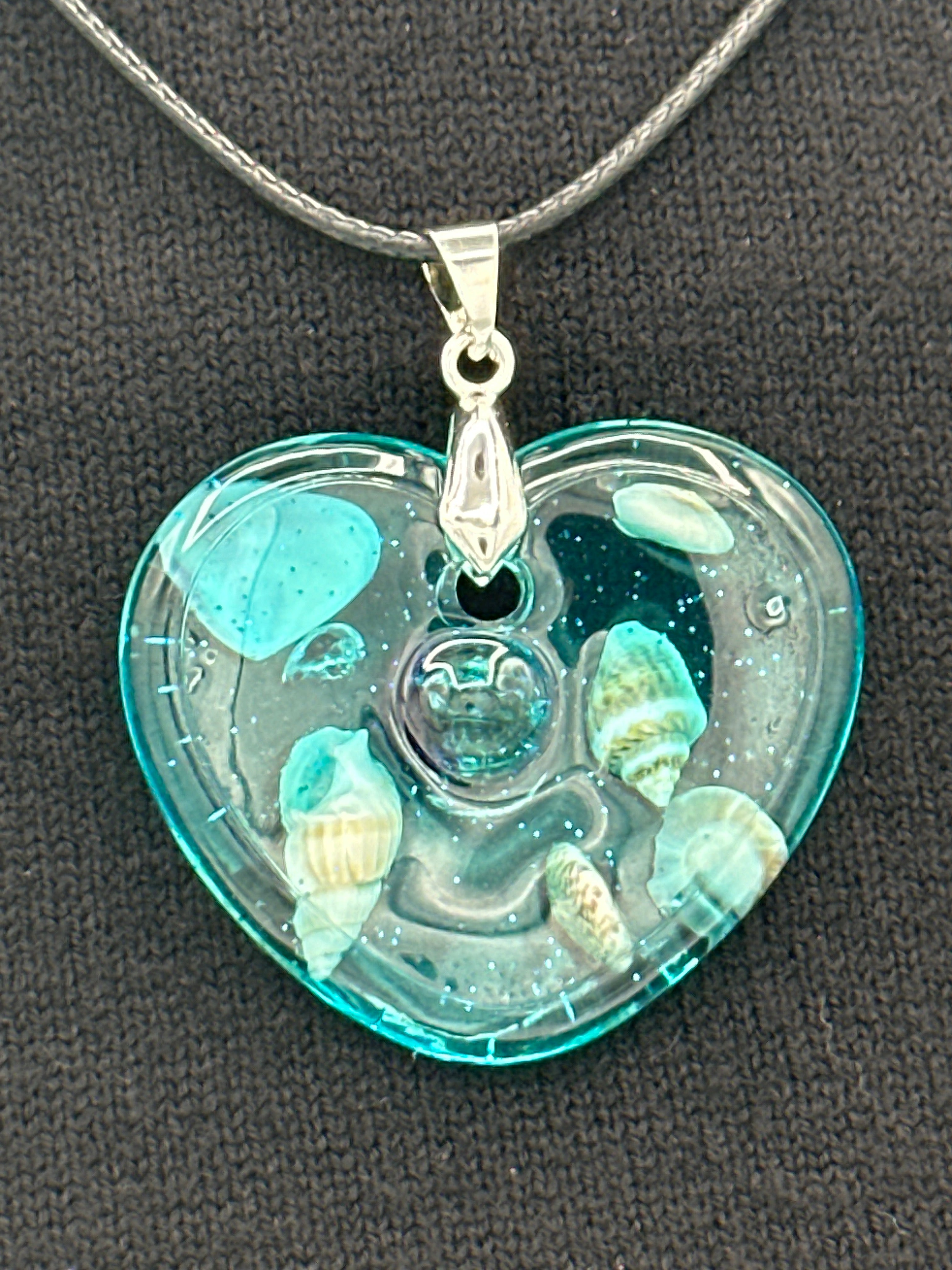Pendant / 1.5 inch /teal glitter/seashell iridescent pearl center/item 1