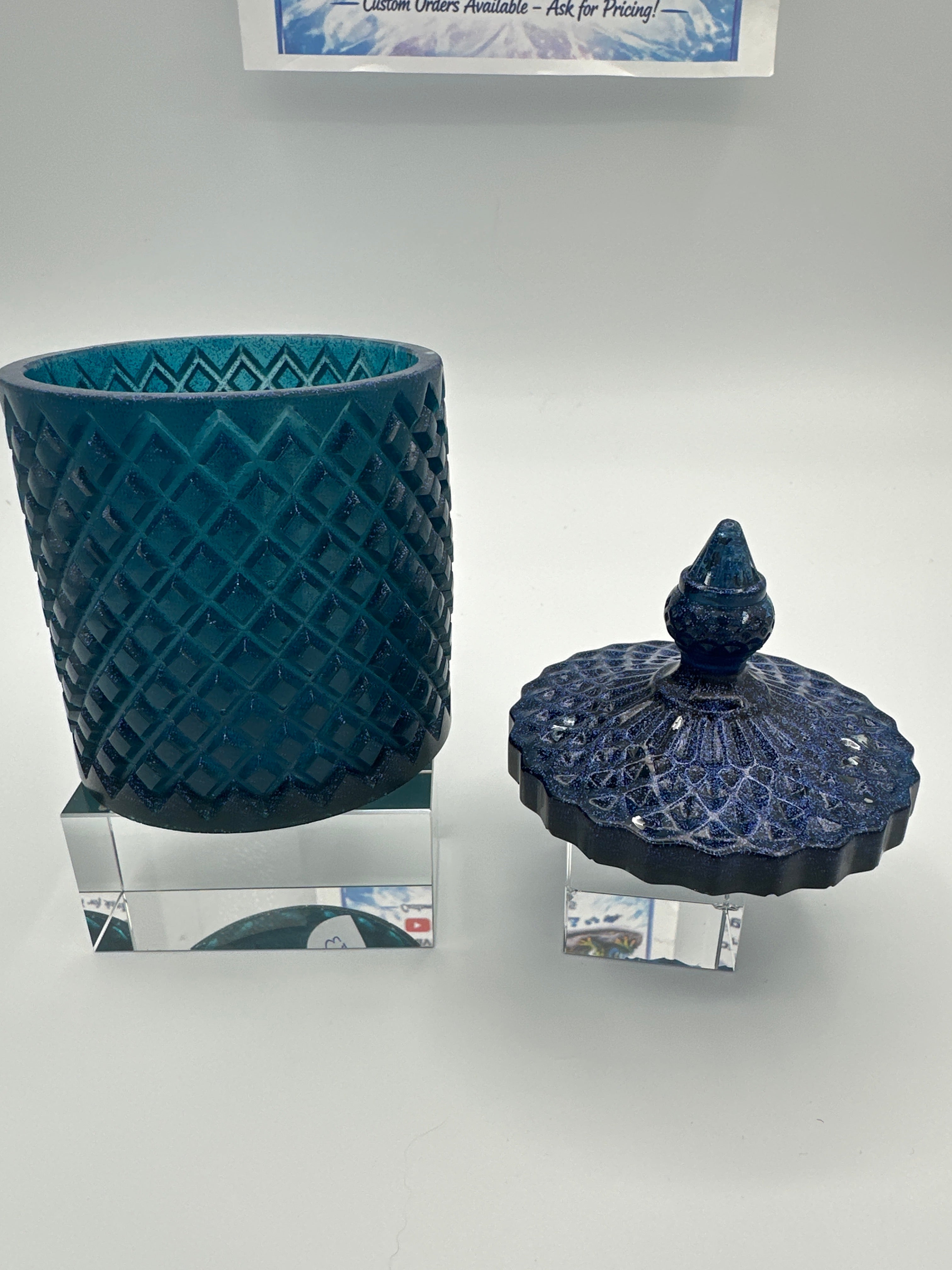 Container with lid 6 inches high/color is deep blue with sparkle/weight 9.0 ounces/item number 83
