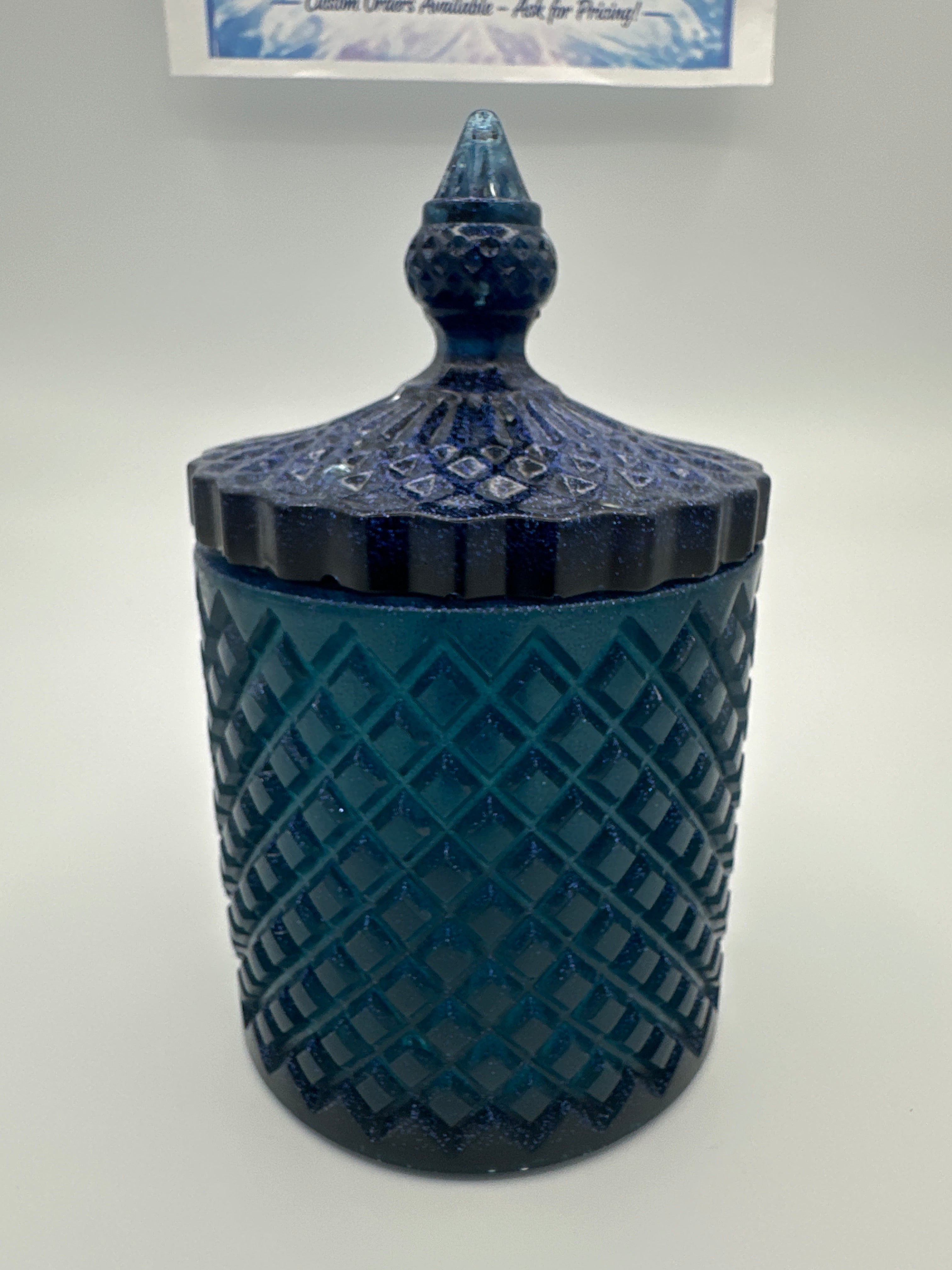 Container with lid 6 inches high/color is deep blue with sparkle/weight 9.0 ounces/item number 83