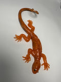 Lizard orange with black design underneath. Item 310