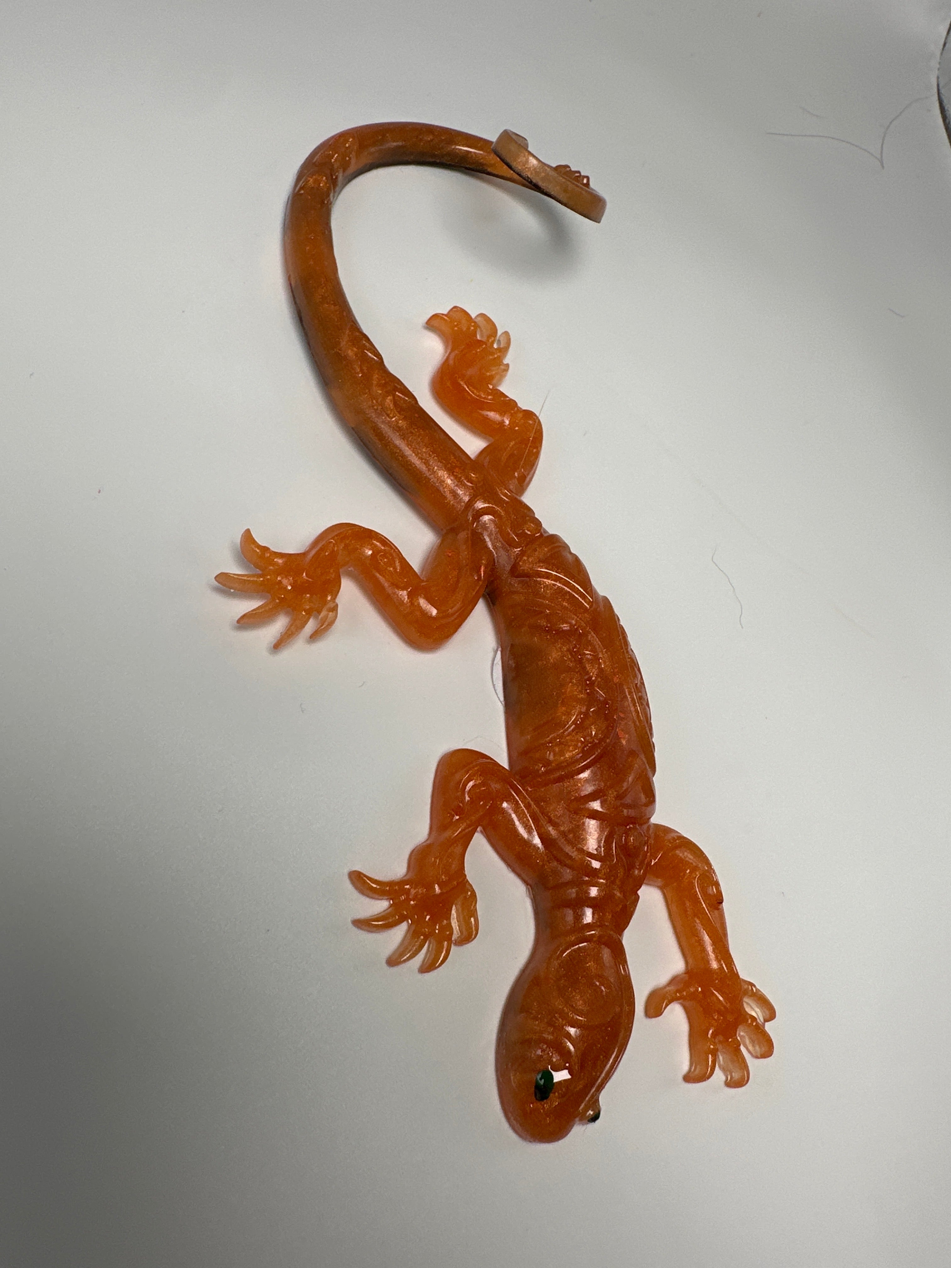 Lizard orange with black design underneath. Item 310