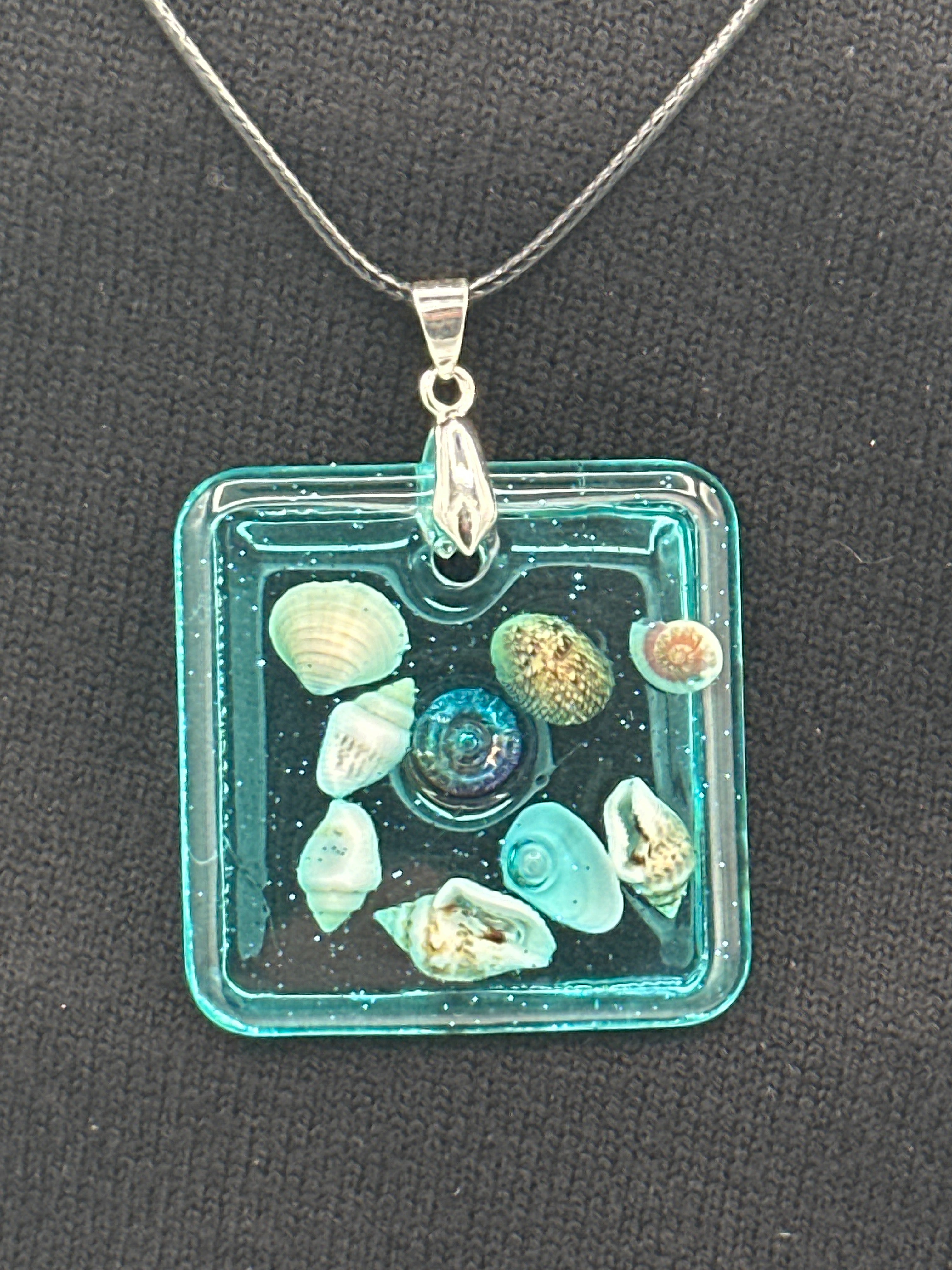 Pendant / 1.5 inch /teal glitter/seashell iridescent pearl center
item 5