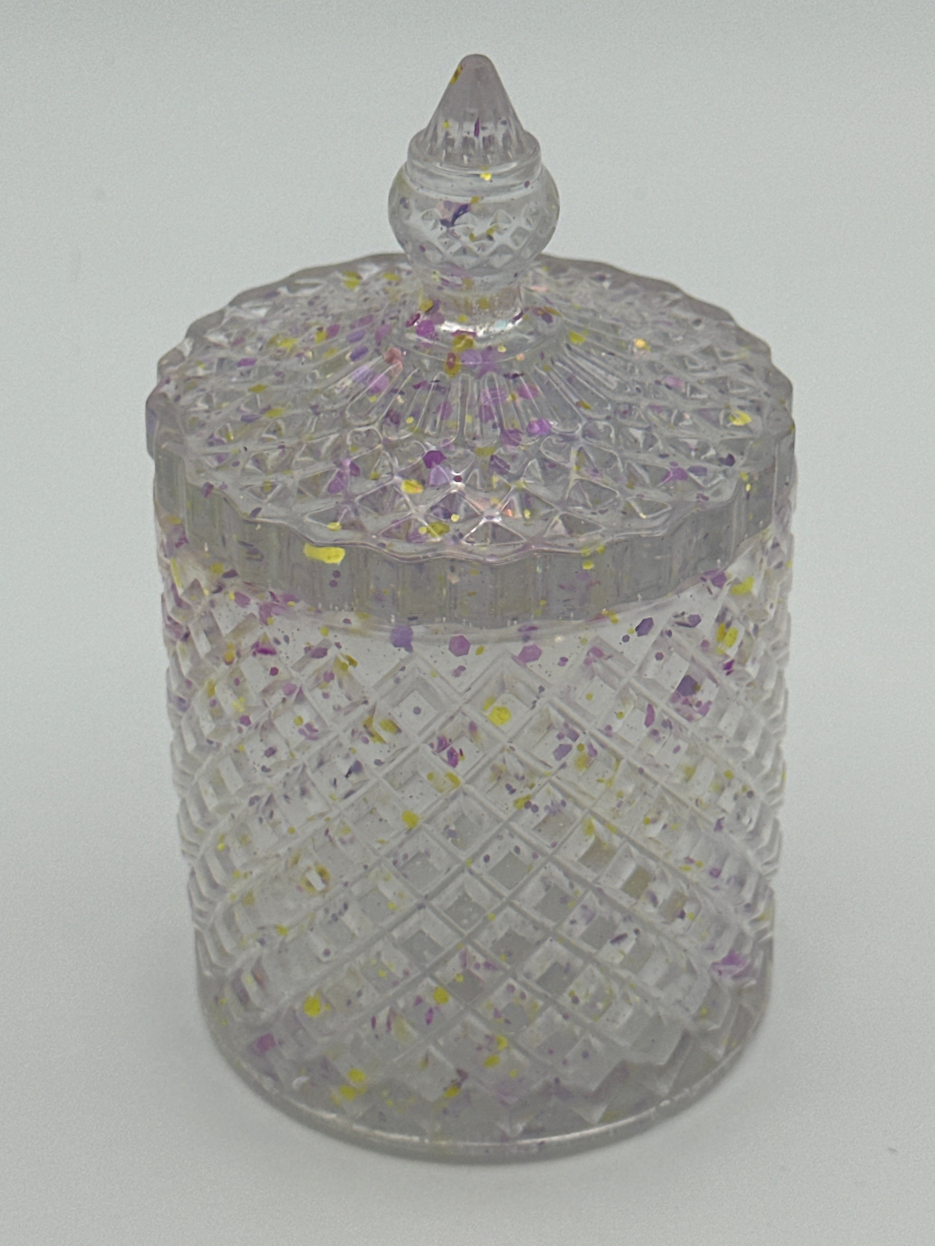 Container with lid is 6 inches in height/color  is clear with purple and flecks. / item number 70