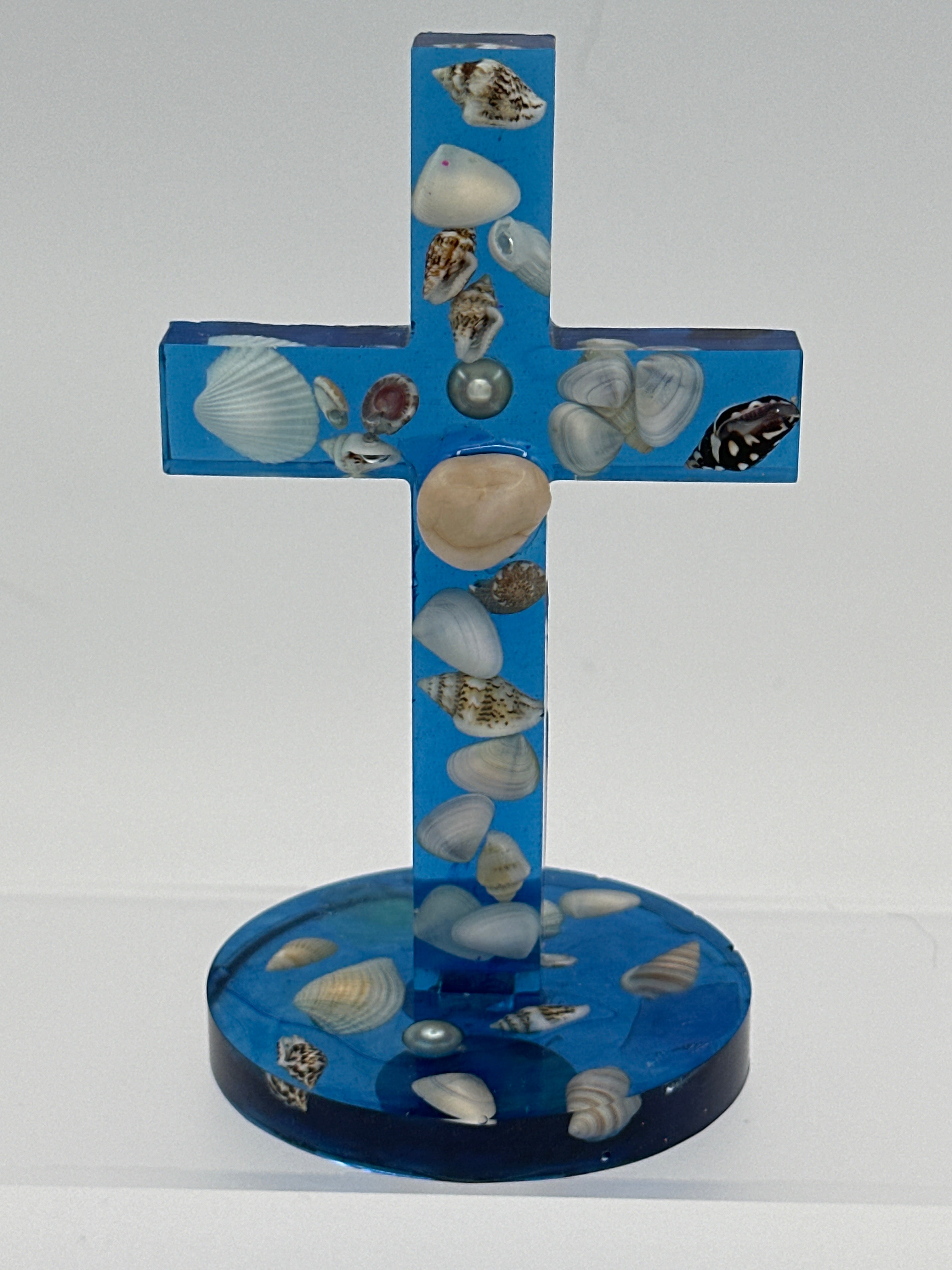Cross- The Rock / 5.25 inches blue/shells, center pearl. Item 138