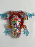Frog Fancy orange with confetti/ pink glitter. Go after your dreams on underbelly. Item 63