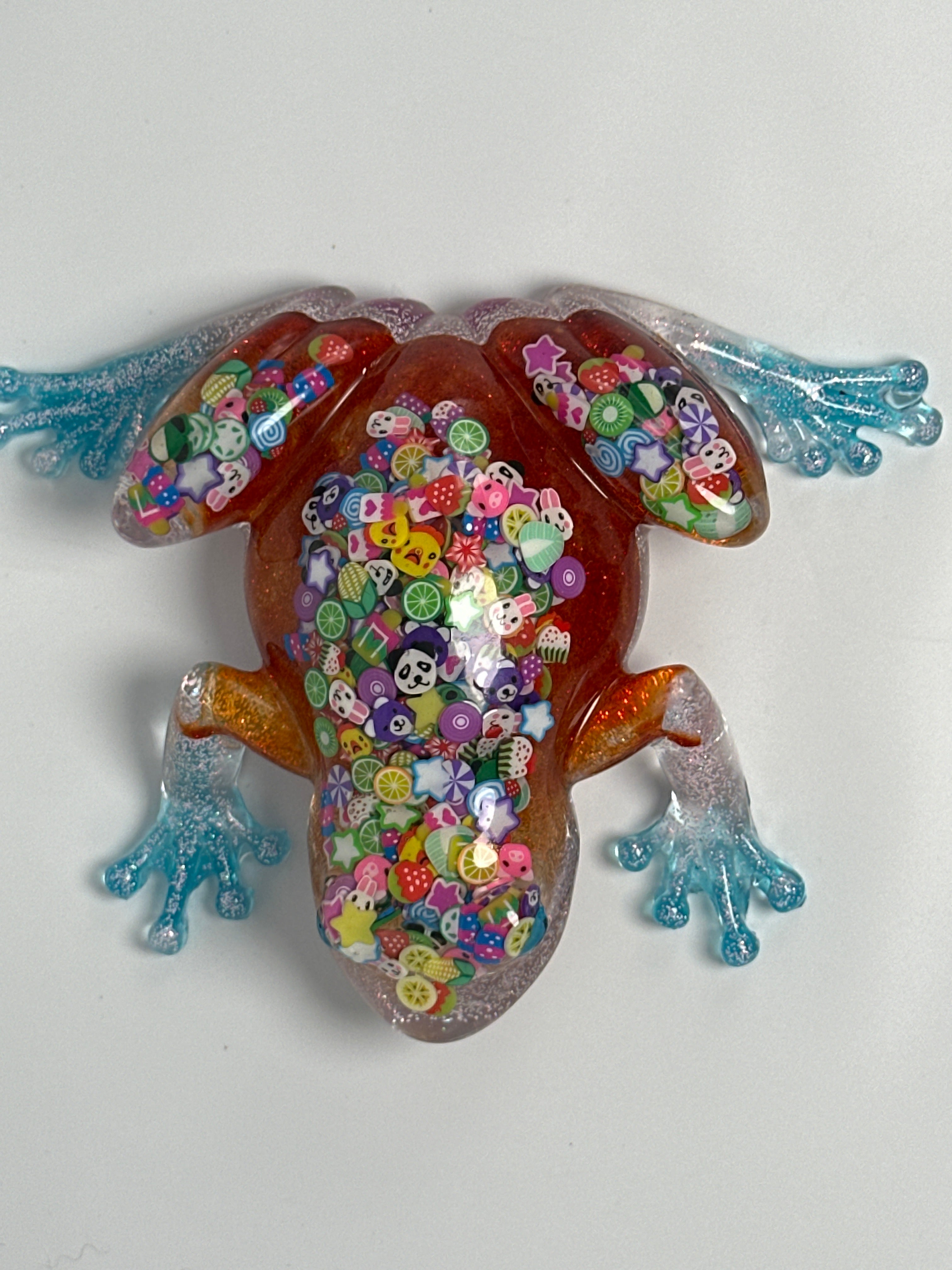 Frog Fancy orange with confetti/ pink glitter. Go after your dreams on underbelly. Item 63