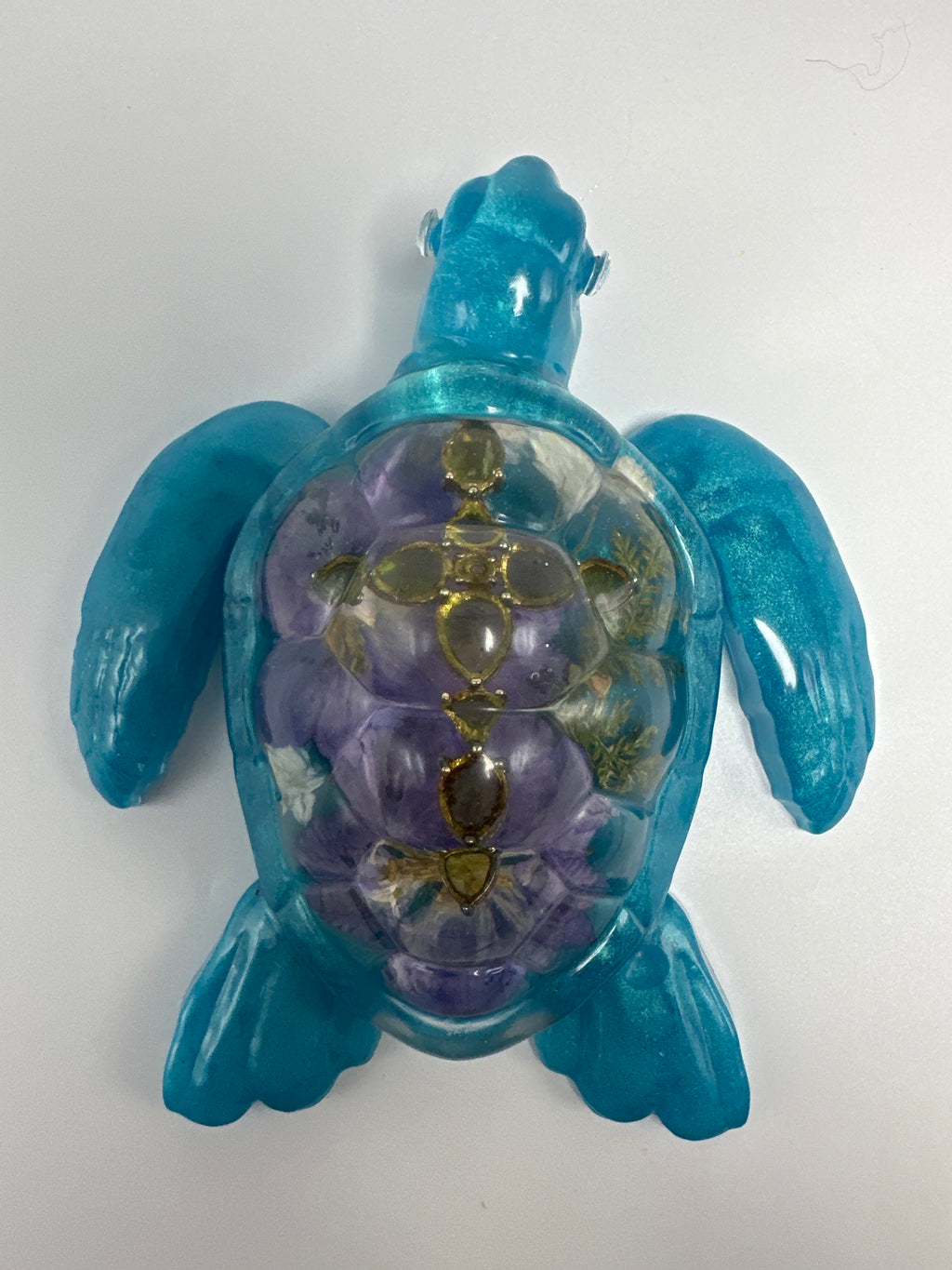 Sea Turtle 5 inch Aqua- Blue floral, Green jeweled cross. Created from epoxy. Turtle has faux diamond eyes. Item 311