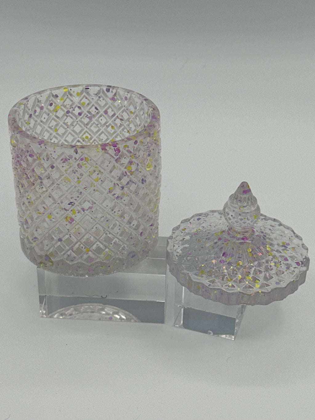 Container with lid is 6 inches in height/color  is clear with purple and flecks. / item number 70