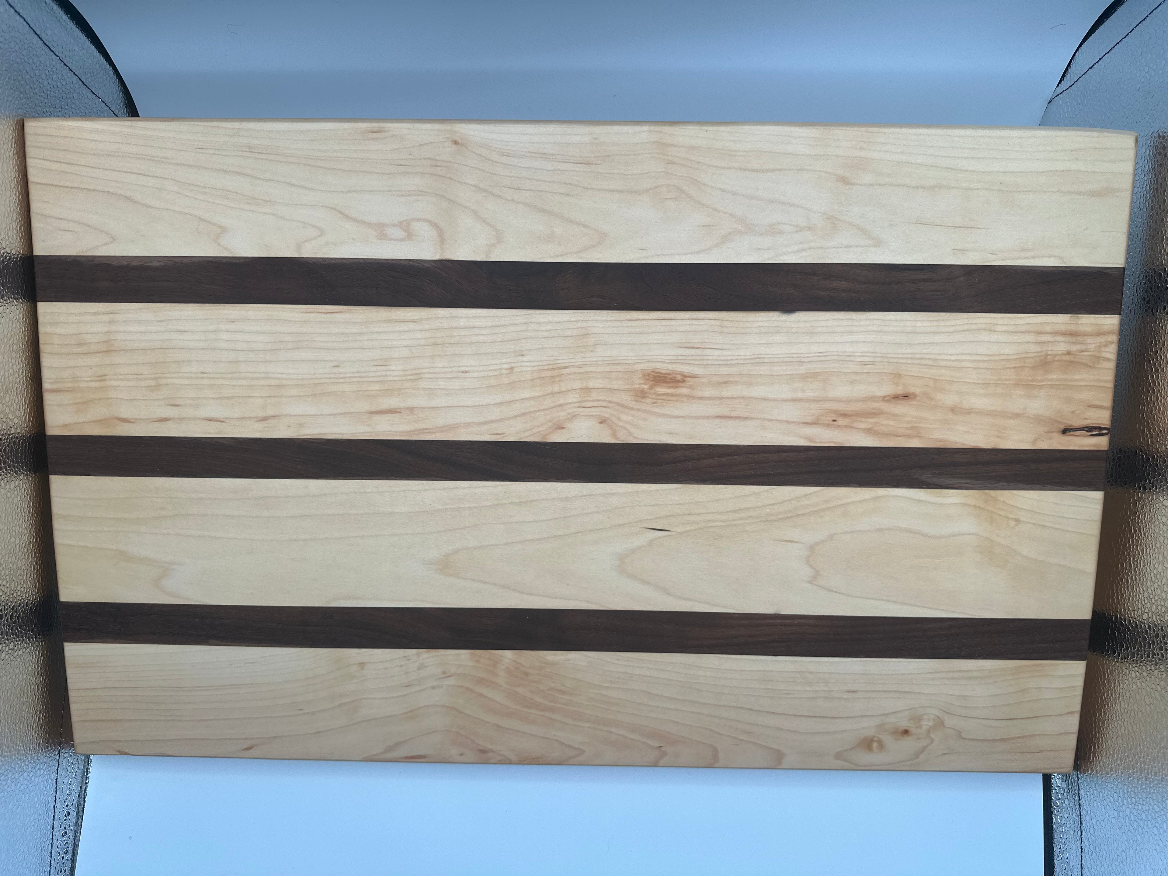 Cutting board/22 and three-quarter inch long/black walnut/maple/item 3
